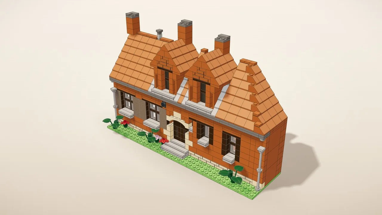 Facade kit: the front of a house in building bricks on a base with a front garden, next to a coffee mug