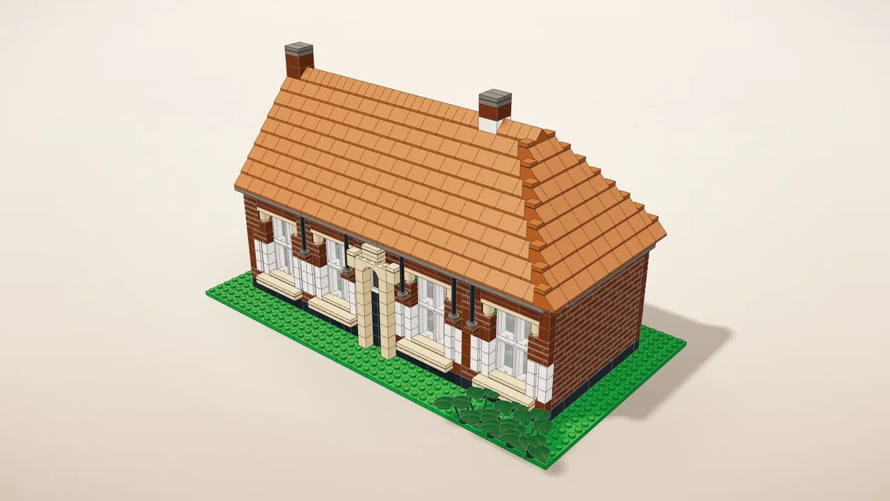Complete kit: the whole house in building bricks on a small base plate, next to a coffee mug